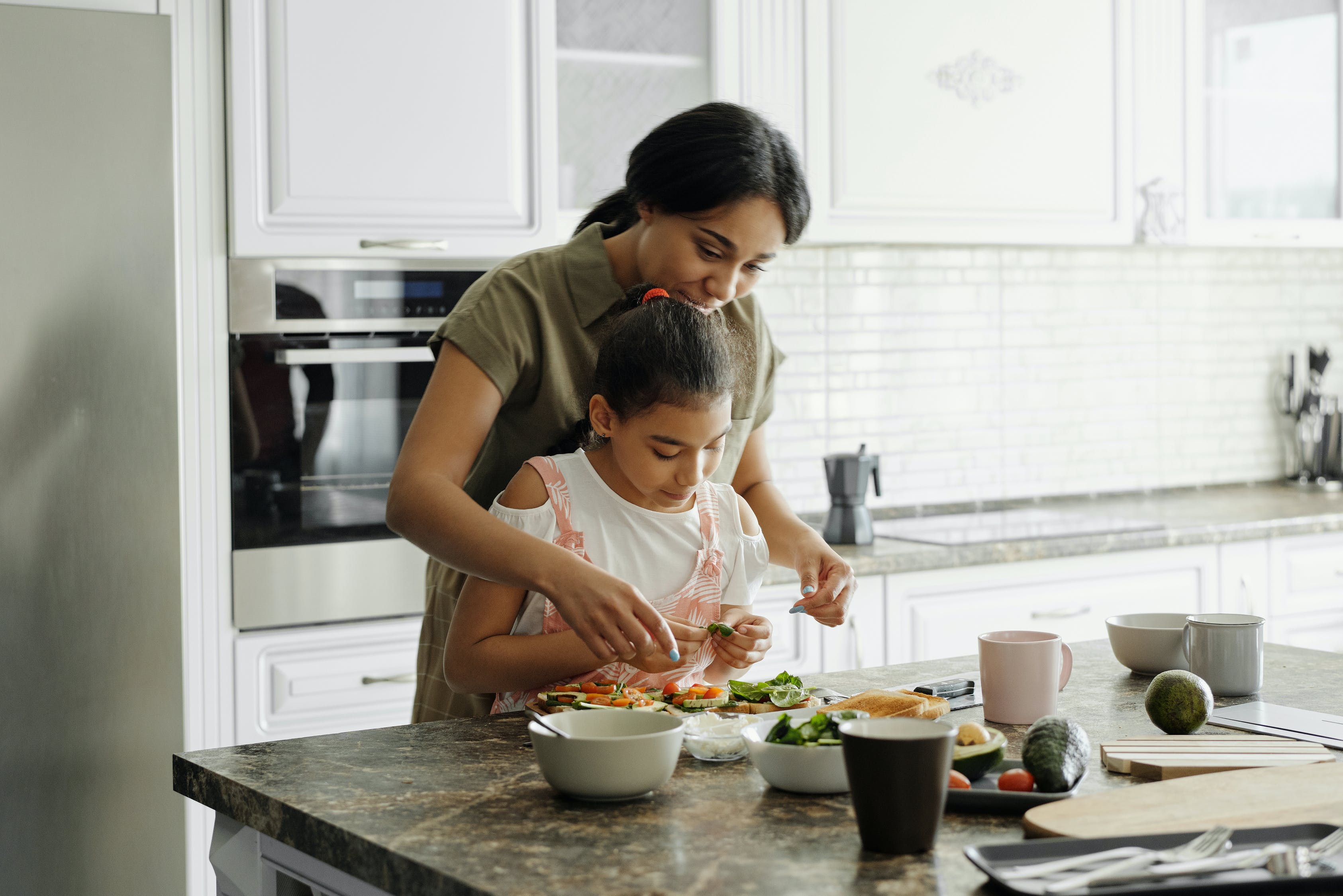 woman-making-lunch-with-daughter